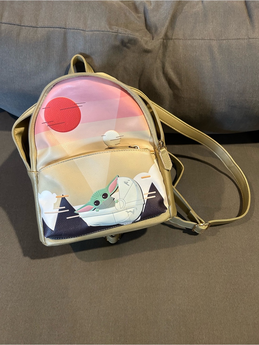 Mini Gold Backpack with Green Character Graphic